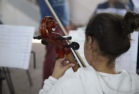 back view of violin student